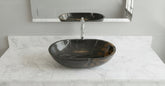 Black marbled oval sink on a white background