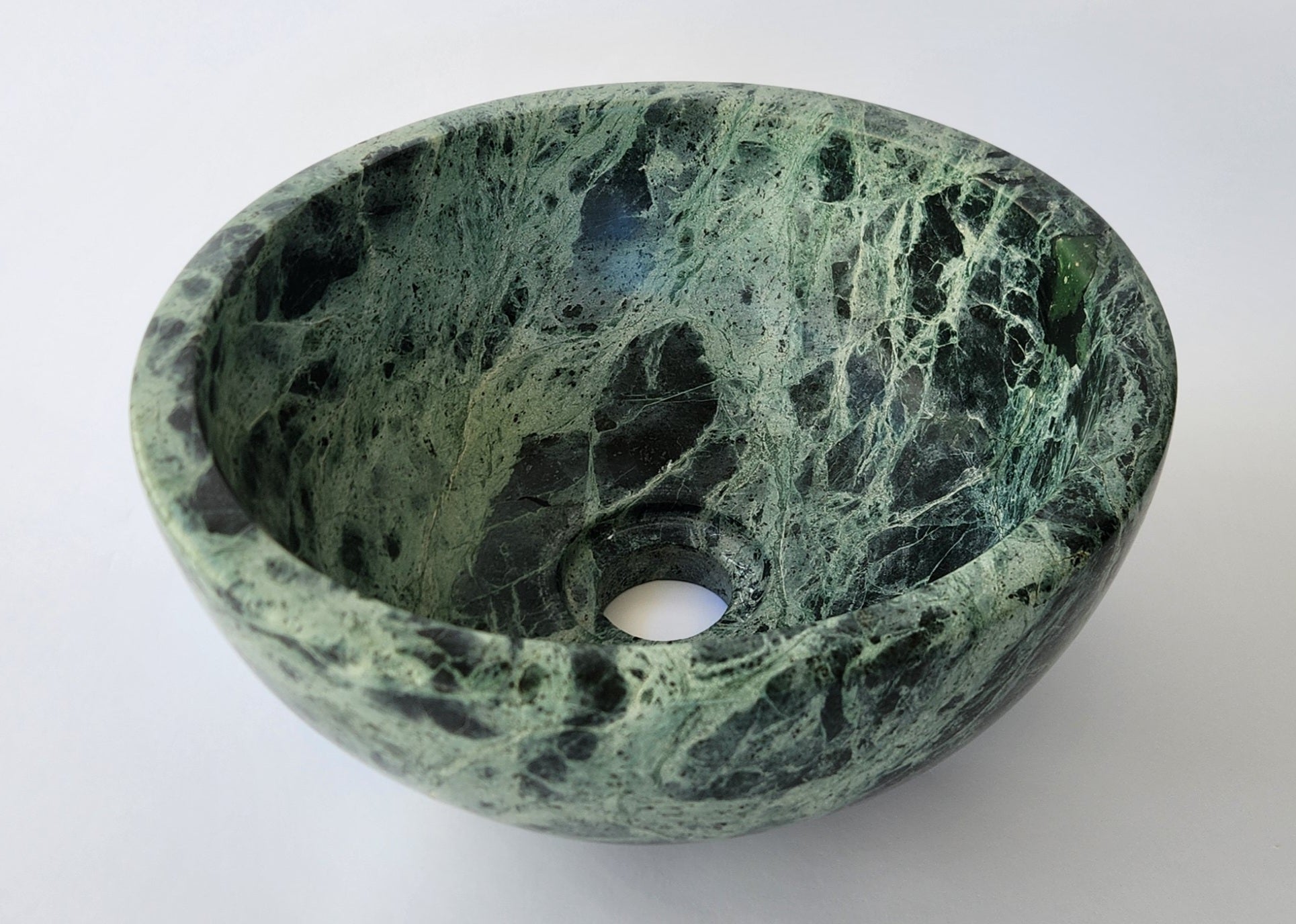 Green marble bowl on a white background