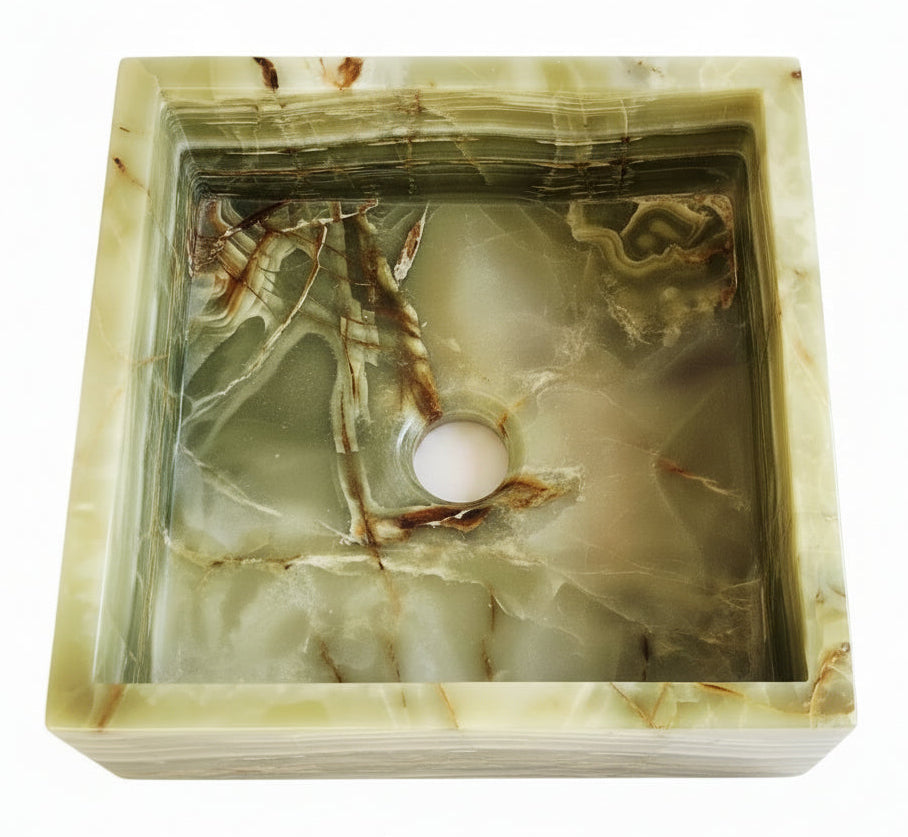 Hexagonal green onyx sink with natural patterns on a white background
