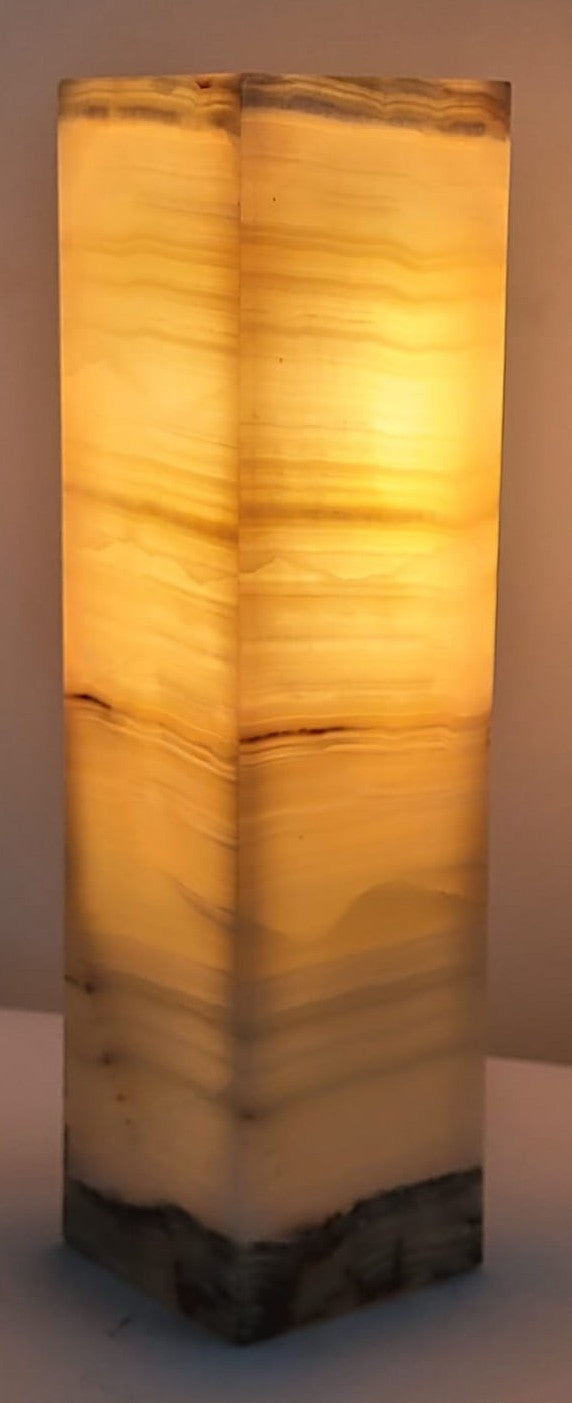 Decorative lamp with a textured surface on a plain background