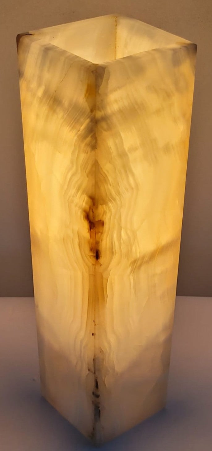 Rectangular lamp with a wood-like texture on a plain background