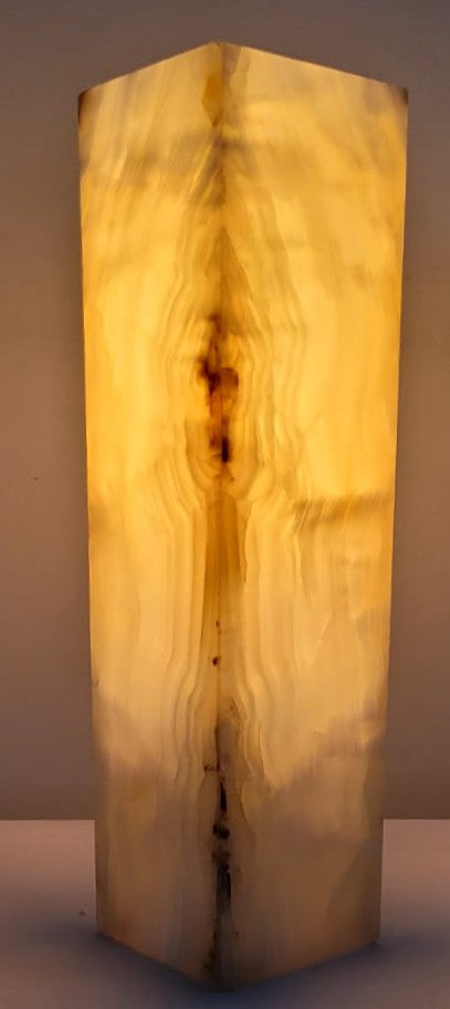 Wooden lamp with a natural grain pattern on a plain background