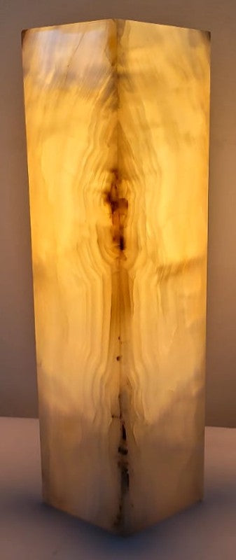 stone lamp with a warm glow on a plain background